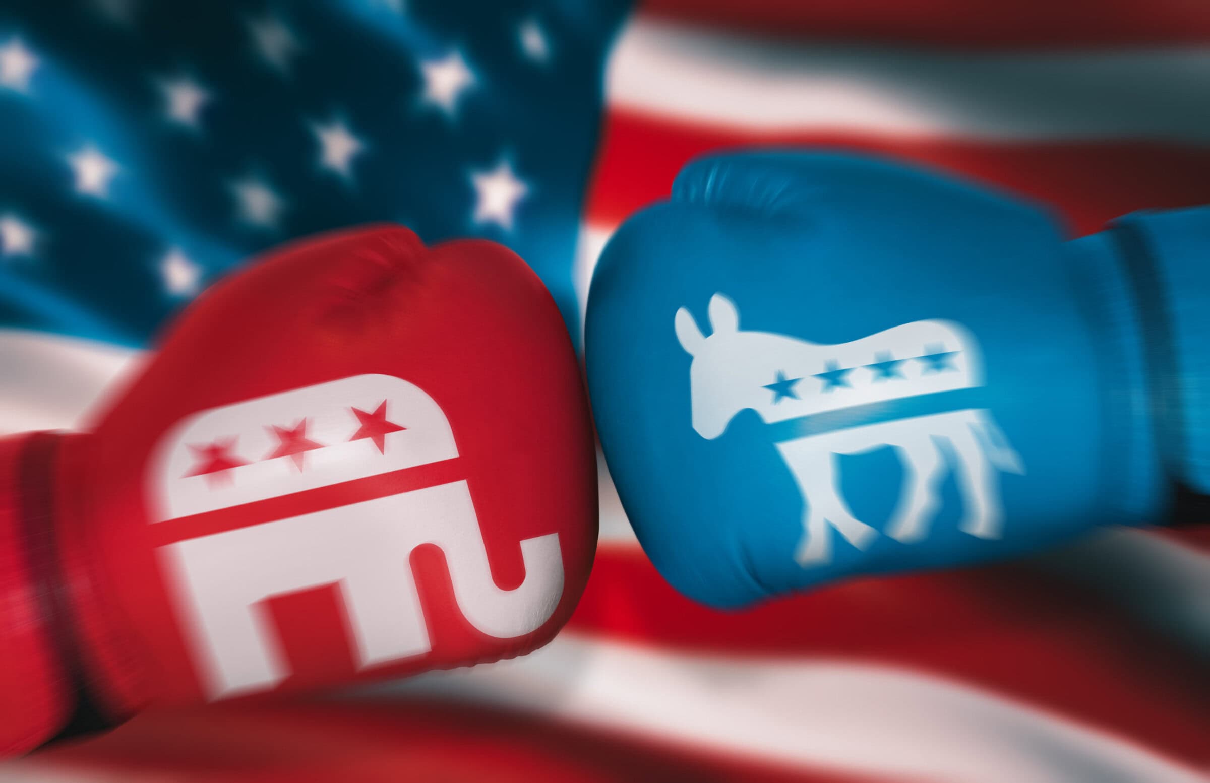 boxing gloves with symbols of USA parties on background of American flag. Concepts of opposition between Republicans and Democrats in congressional elections. motion blur effect. August 24, 2022