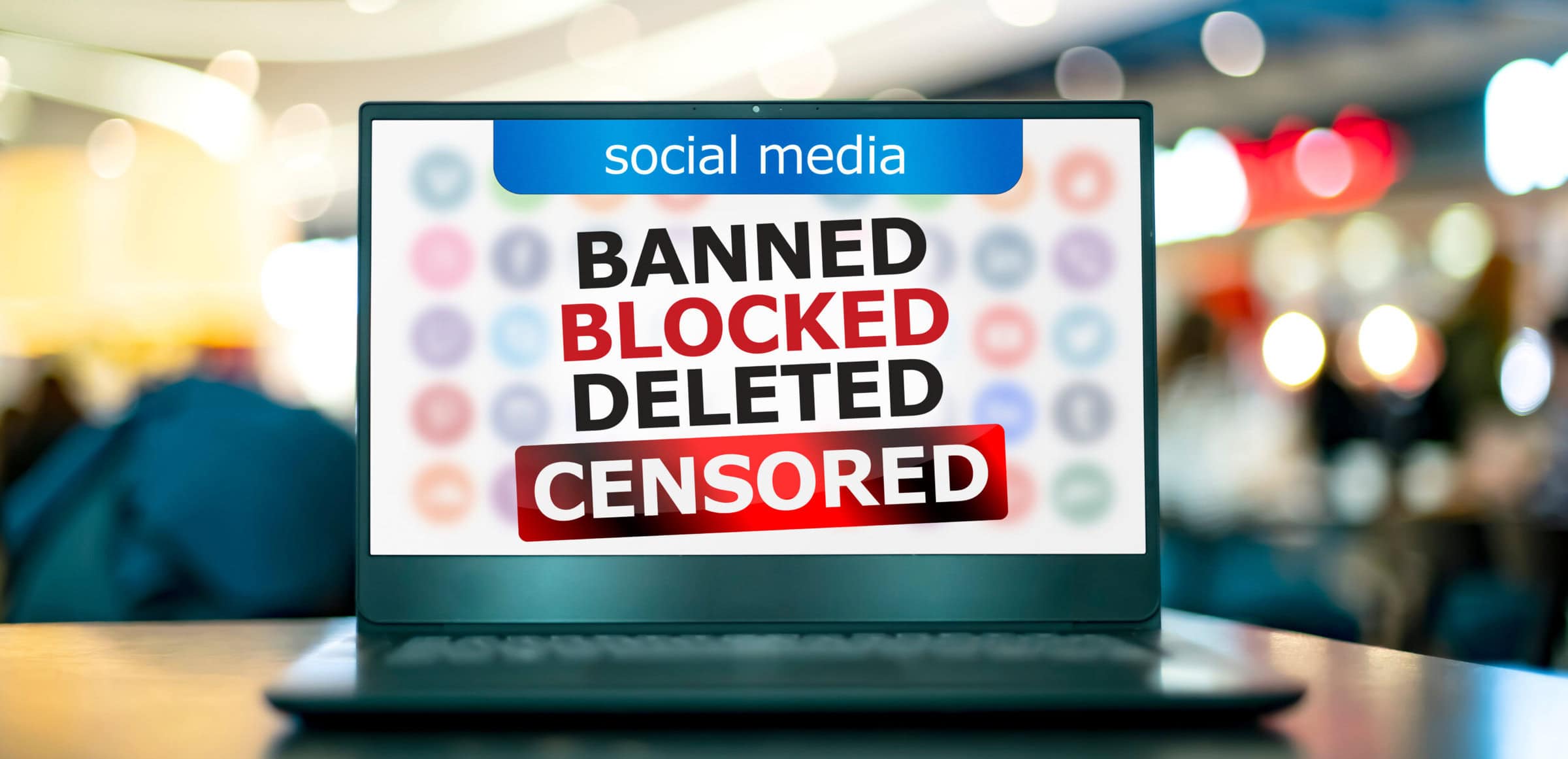 Laptop with the sign warning against censorship in social media Laptop computer with the sign warning against censorship in social media