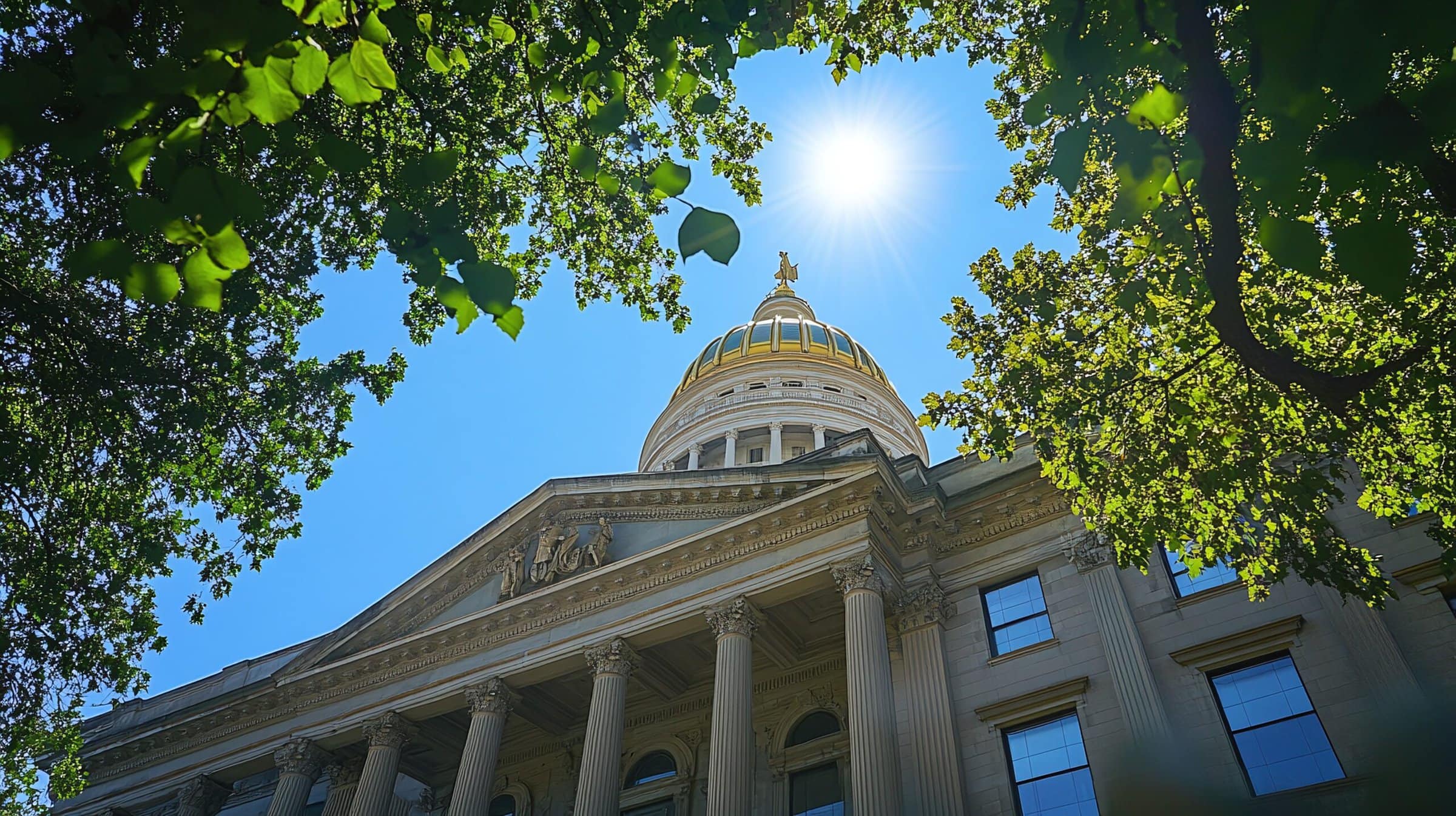 The Georgia State Capitol building in Atlanta, with its iconic gold dome shining under a clear blue sky The Georgia State Capitol building in Atlanta, with its iconic gold dome shining under a clear blue sky