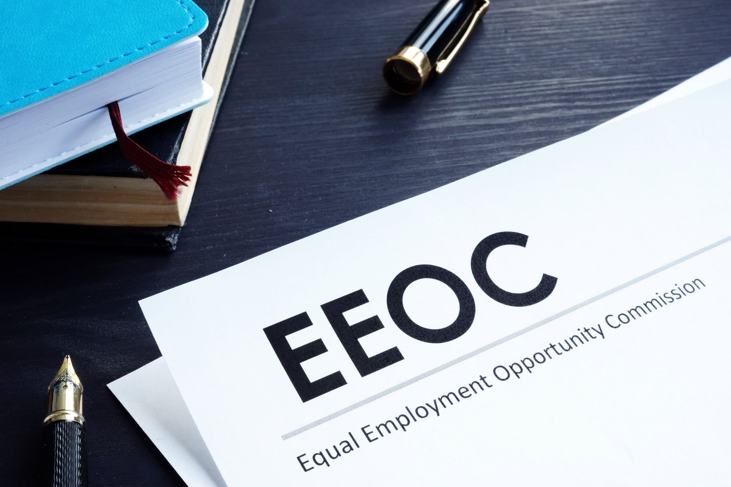 Equal Employment Opportunity Commission EEOC document and pen on a table. Equal Employment Opportunity Commission EEOC document and pen on a table.